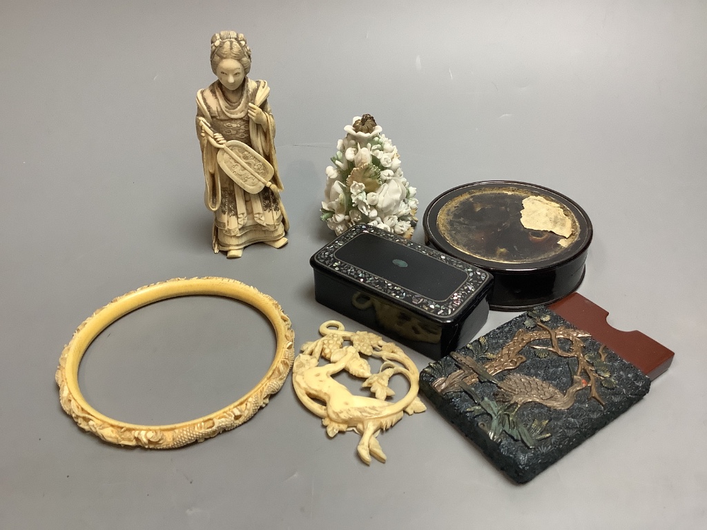 A Japanese carved ivory female figure, a circular tortoiseshell box, a carved ivory bangle and pendant late 19th/early 20th century etc.